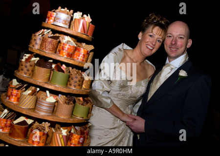 Bride and Groom cutting the wedding cake Stock Photo