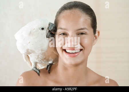 Girl with pet cockatoo Stock Photo