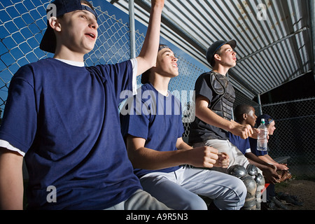 Five teenagers watching from the sidelines Stock Photo - Alamy