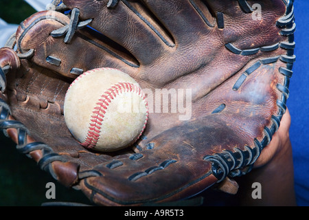 Boy holding baseball in a baseball glove Stock Photo