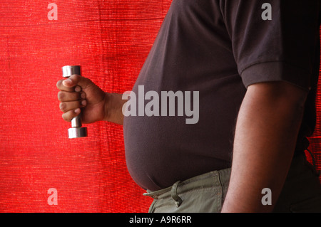 An obese man exercising Side view Stock Photo