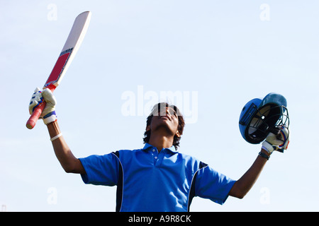 Batsman looking up at the sky in jubilation Stock Photo