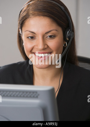 Indian businesswoman wearing headset Stock Photo