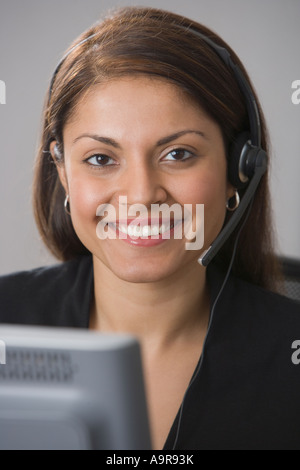 Indian businesswoman wearing headset Stock Photo