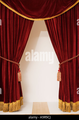 Screen behind open stage curtains Stock Photo