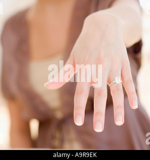 Woman showing off engagement ring Stock Photo