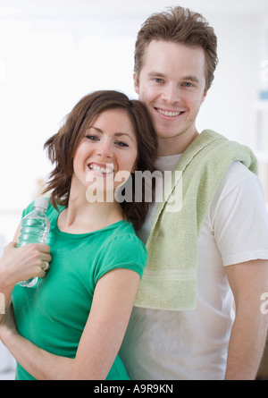 Couple with towel and water bottle Stock Photo