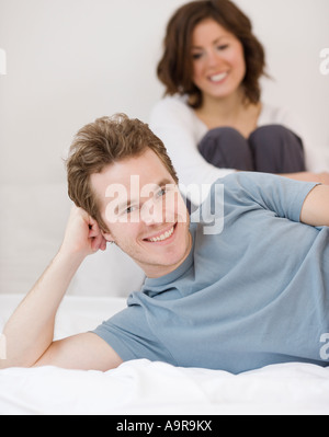 Couple sitting in bed Stock Photo