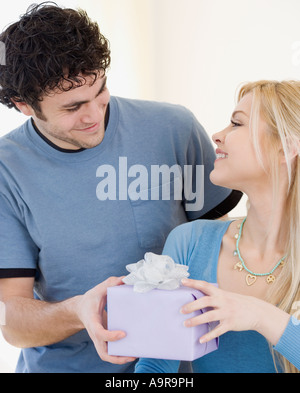 Man giving gift to girlfriend Stock Photo
