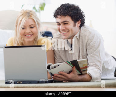 Couple looking at laptop Stock Photo