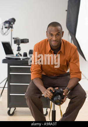 Portrait of male photographer in studio Stock Photo