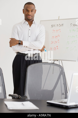 Portrait of businessman next to whiteboard Stock Photo