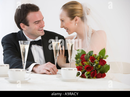 Bride and groom with champagne Stock Photo