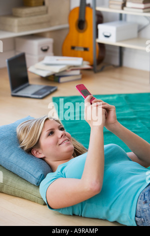 Woman looking at cell phone Stock Photo
