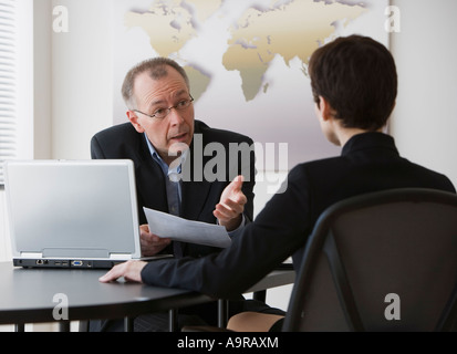 Businessman and businesswoman having meeting Stock Photo