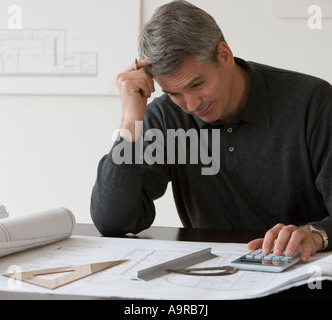 Male architect working at desk Stock Photo