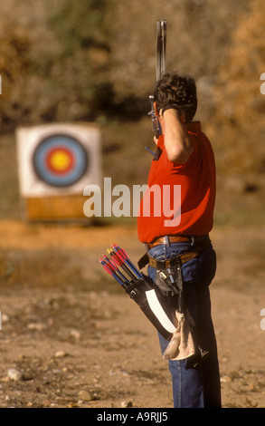 One male archer aiming for target. Stock Photo