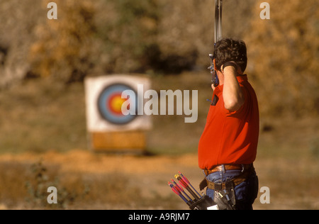 One male archer aiming for target. Stock Photo