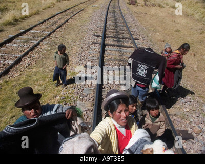 Peruvian women selling goods on the railtrack between Cusco and Puno, Peru Stock Photo