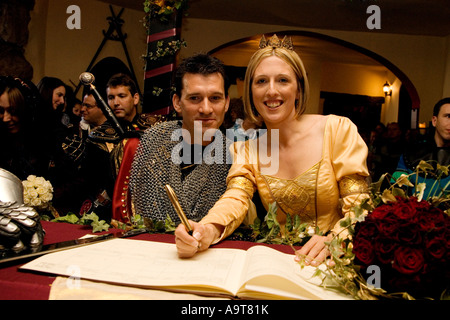 Bride and Groom signing the register Stock Photo