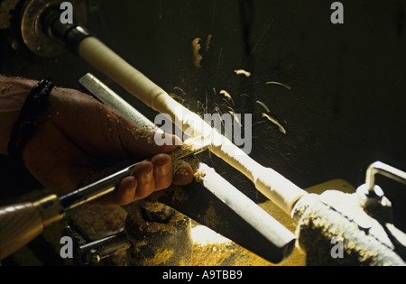 woodworker using gouge on wood lathe close up of hands Stock Photo