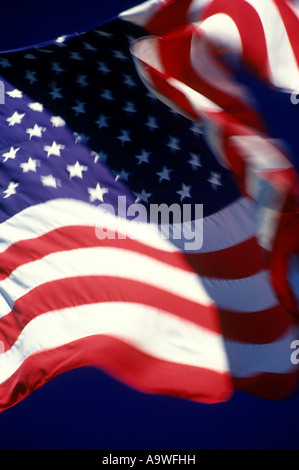UNITED STATES FLAG FLYING ON FLAGPOLE WITH BLUE SKY Stock Photo - Alamy