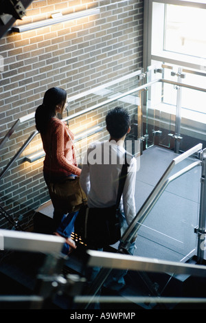 University students walking upstairs between classes Stock Photo