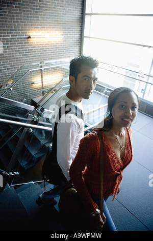 University students walking downstairs between classes Stock Photo