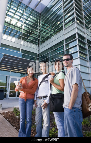College students standing in front of a building Stock Photo