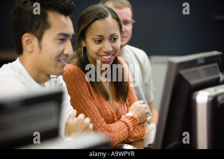 Three university students using computer Stock Photo