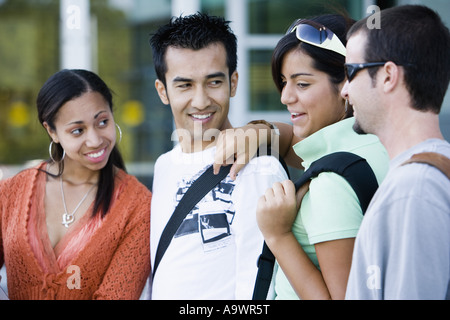 Students standing side by side and smiling Stock Photo