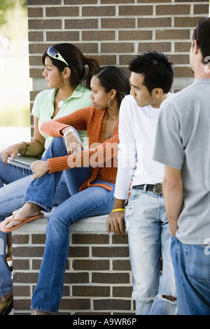 Students sitting together and looking away Stock Photo