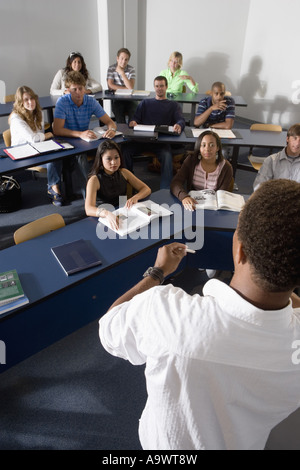 Teacher teaching students in the classroom Stock Photo