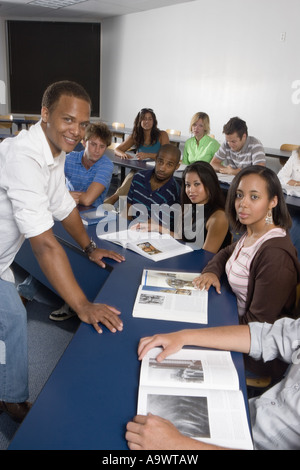 Portrait of teacher with students in classroom Stock Photo - Alamy
