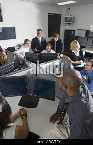 Group of young workers in office having meeting Stock Photo
