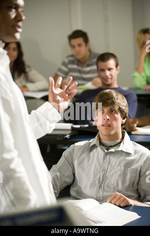 Teacher teaching students in the classroom Stock Photo