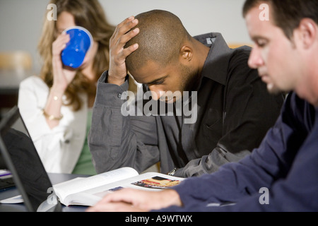 African college students using laptop together isolated on white ...