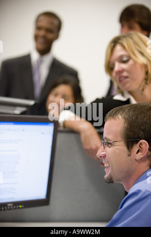 Office workers working on computer Stock Photo