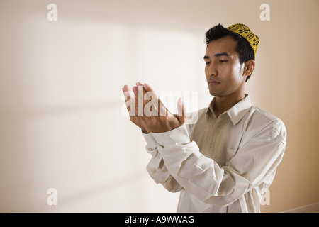 A Muslim man praying Stock Photo