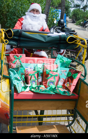 santa claus delivering gifts in rickshaw Stock Photo