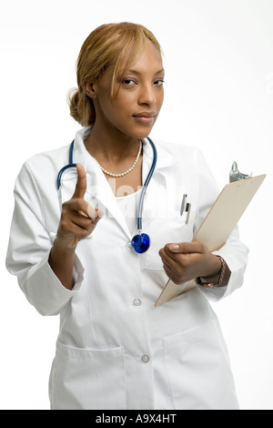 Doctor admonishes the patient with a pointed finger wearing a white coat Stock Photo