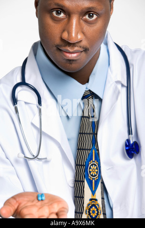 man with pill - blue white pills in man hand isolated Stock Photo - Alamy