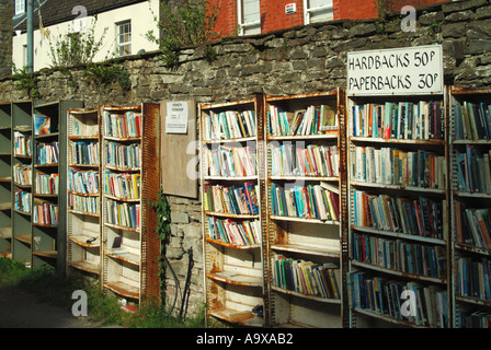 Hay on Wye Honesty Bookshop signs self service selling low priced  hardbacks at 50p and paperbacks at 30p booksellers outdoor shelves Powys Wales UK Stock Photo