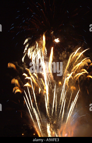 Explosion of Fireworks taken on bonfire night against a dark black night sky Stock Photo