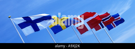 ROW OF SCANDINAVIAN FLAGS FLYING ON FLAG POLES FINLAND SWEDEN DENMARK NORWAY ICELAND Stock Photo