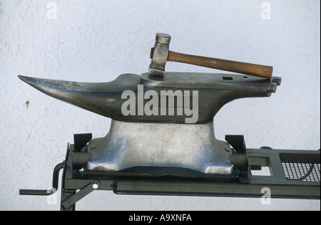 anvil and hammer of a blacksmith. Stock Photo