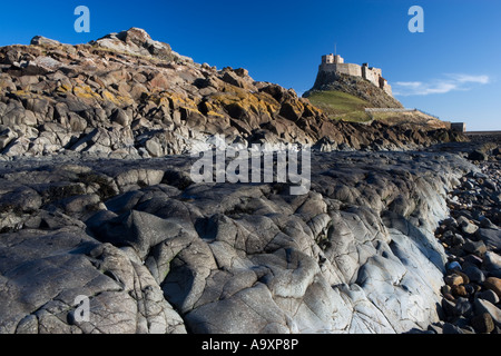 View of Lindisfarne Castle from the beach on a summers day, Holy Island, Northumberland, England, UK Stock Photo