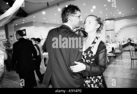 Poland, Lodz, groom dancing at wedding party, rear view (B&W) Stock Photo