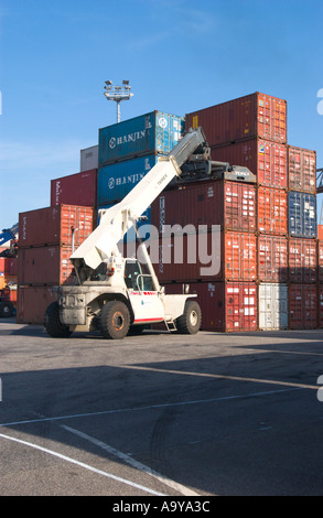 lifter loader moving freight container in container terminal Stock Photo