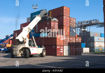 lifter loader moving freight container in container terminal Stock Photo